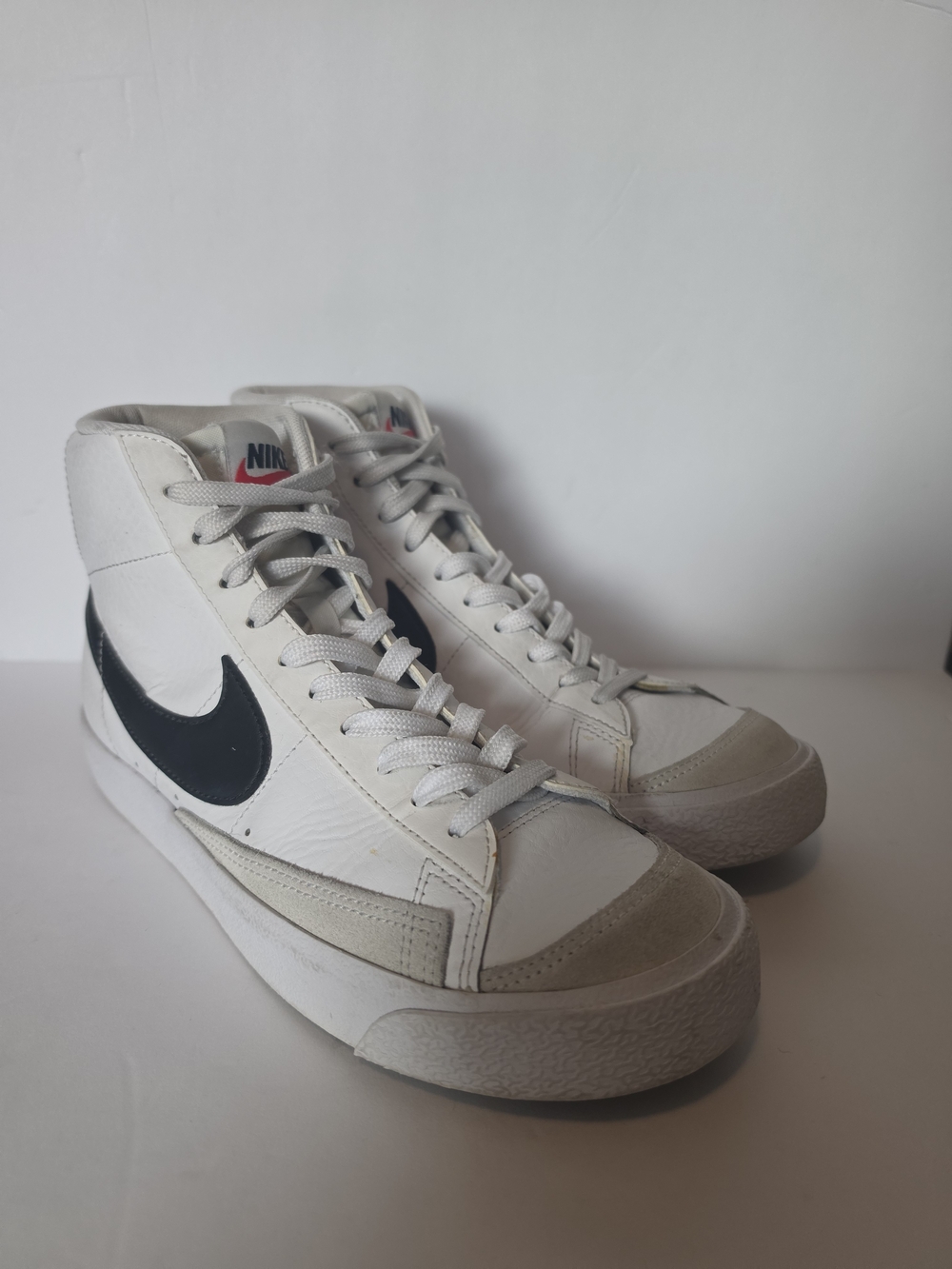 Nike Men’s White High-Top Sneakers with Black Swoosh Accent